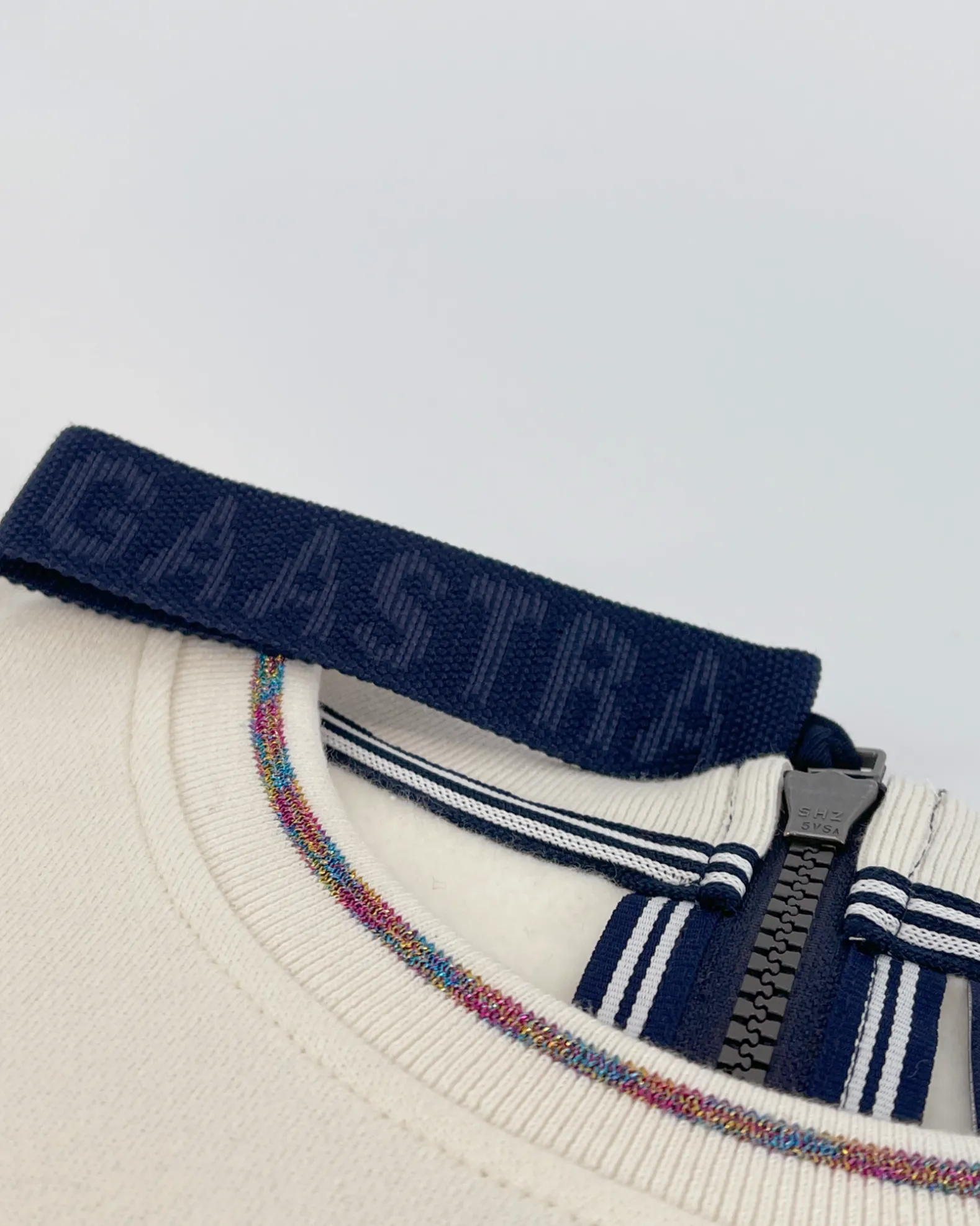 Trui Equator Met Glitter Branding